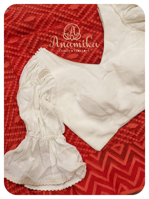 Red Dhakai saree with white ruffle blouse