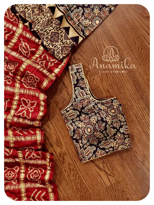 Maroonish Red Gharchola saree with Ajrak Pallu