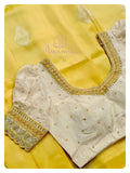 Yellow/off white kanchi silk saree with puff sleeves blouse