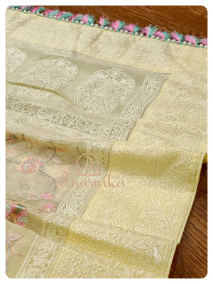 Pastel Yellow organza saree with pink pearl work blouse