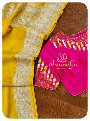 Yellow banarasi chiffon saree with pink blouse