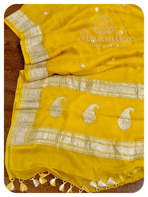 Yellow banarasi chiffon saree with pink blouse